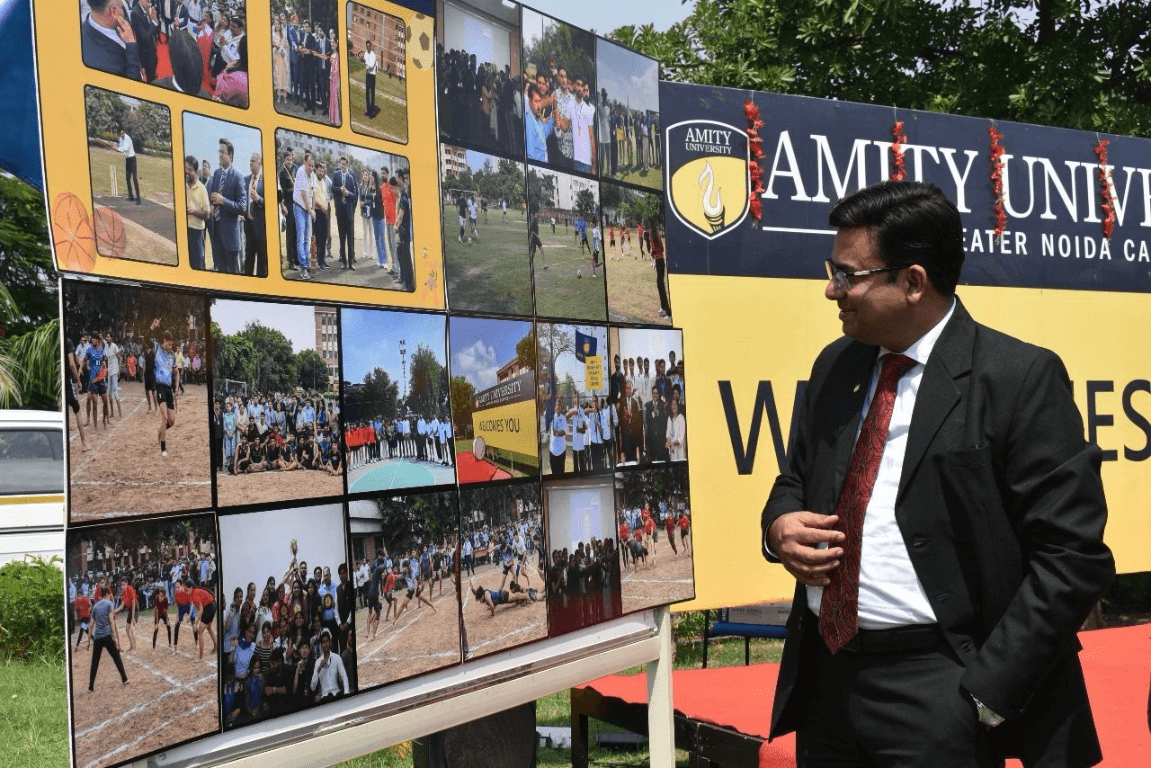 Dr Ajay Rana viewing Amity University photo display