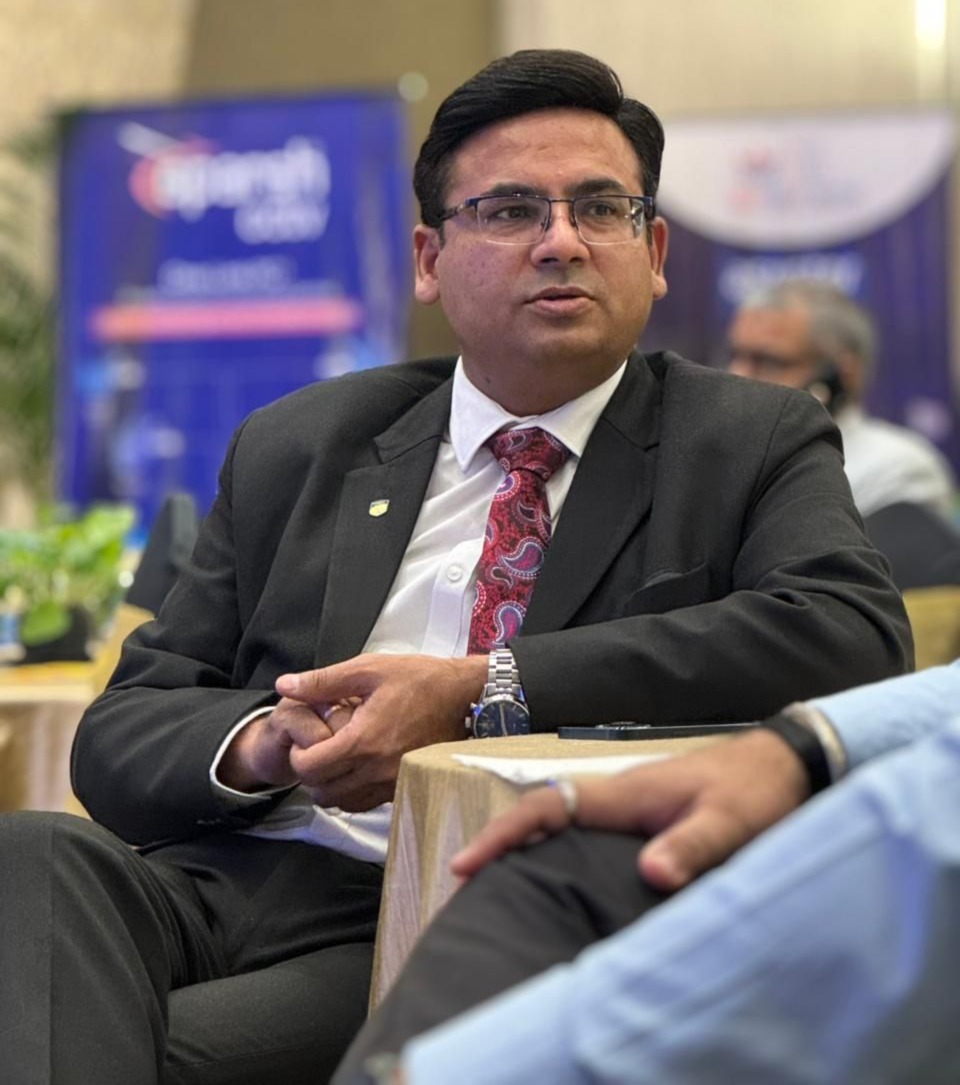 Dr Ajay Rana attending a panel discussion or conference