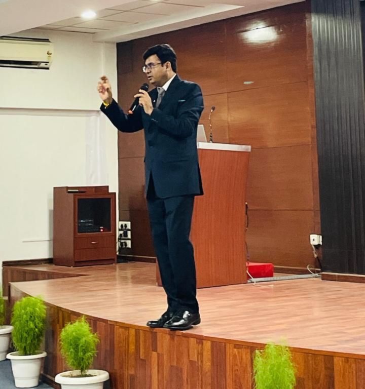 Dr Ajay Rana giving an energetic stage presentation