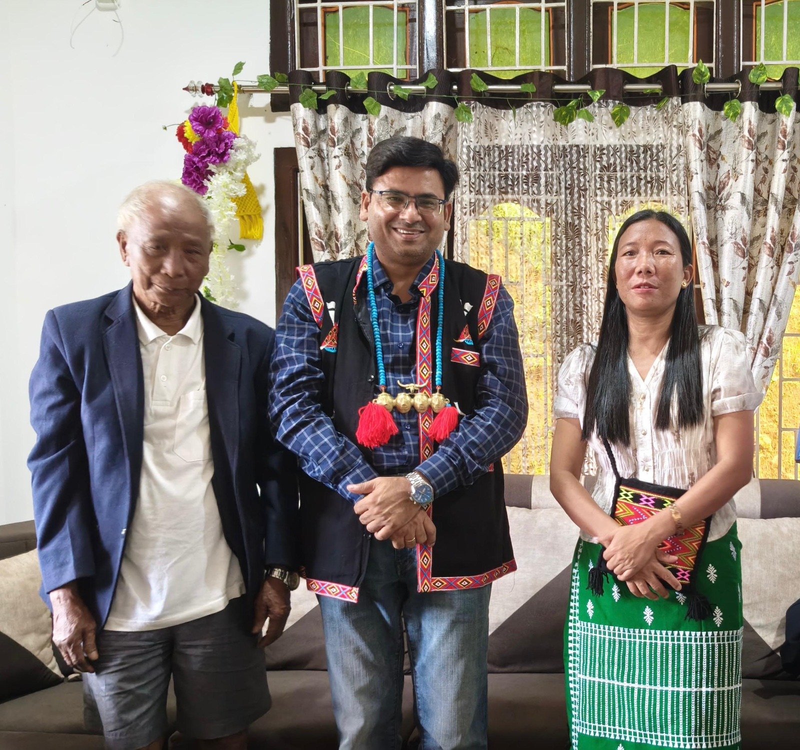 Dr Ajay Rana in traditional Naga attire with community members